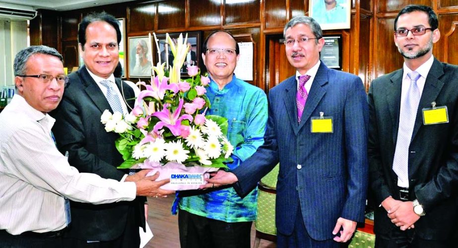 Niaz Habib, Managing Director of Dhaka Bank Limited, congratulating Bangladesh Bank Governor Dr Atiur Rahman for acheiving the Best Central Banker of the Year for 2015 at the latterâ€™s office on Sunday.