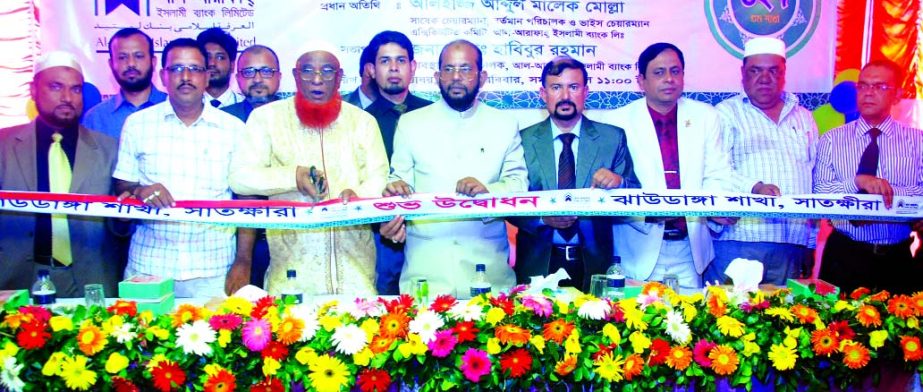 Abdul Malek Mollah, Director of Al-Arafah Islami Bank Ltd, inaugurating its 127th branch at Jhaudanga, Satkhira on Sunday. Managing Director Md Habibur Rahman presided.