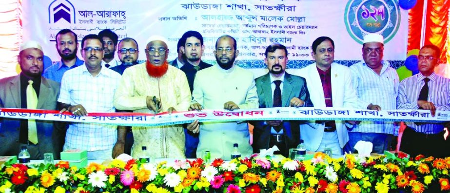 Abdul Malek Mollah, Director of Al-Arafah Islami Bank Ltd, inaugurating its 127th branch at Jhaudanga, Satkhira recently. Managing Director Md Habibur Rahman was present.