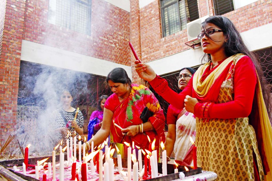 Devotees celebrating Bijoya Dashami at city's Dhakeshwari Mandir by lighting candles on the occasion of biggest festival of Durga Puja on Thursday.