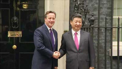 Chinese President Xi Jinping shaking hands with British Prime Minister David Cameron in London.