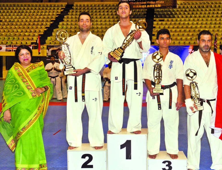Speaker of the Jatiya Sangsad Dr Shirin Sharmin Chaudhury and the winners of theInternational Open Full-Contact Karate Tournament pose for a photo session at the Shaheed Suhrawardy Indoor Stadium in Mirpur on Friday. International Karate Organization of B
