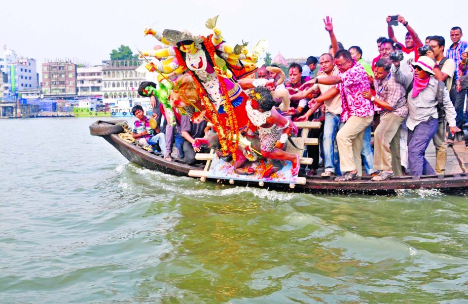 The people of Hindu community have formally bid adieu to Goddess Durga through immersion of idols . This photo was taken from the city's Wiseghat area of River Buriganga on Friday.