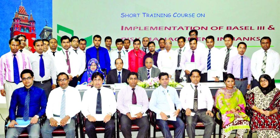 Syed Mohammad Bariqullah, Deputy Managing Director of National Bank Limited, poses with the participants of a two-days short course on "Implementation of Basel-III & Risk Management in Banks" at its training institute recently.