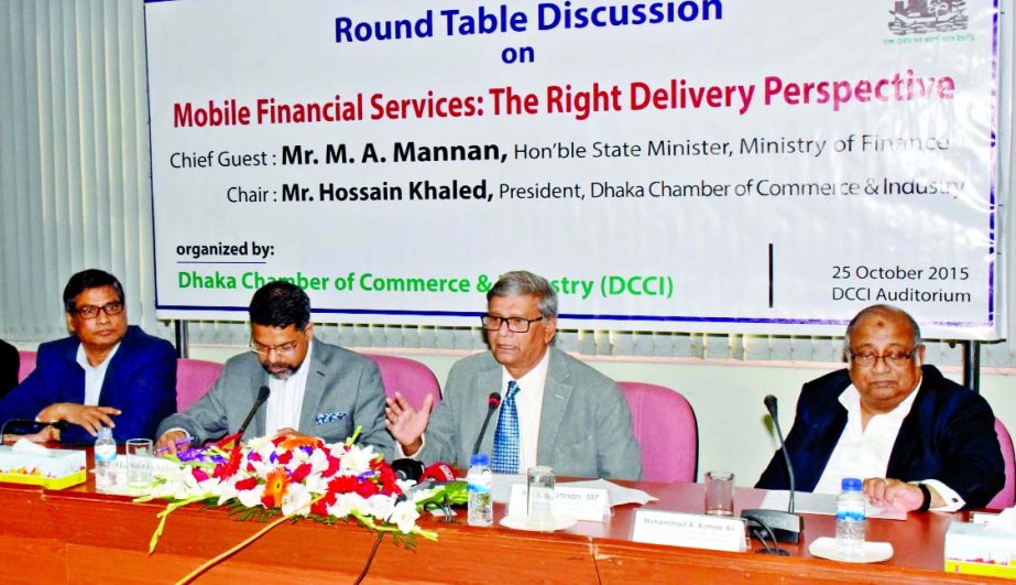 State Minister for Finance and Planning M A Mannan addressing a roundtable discussion on 'Mobile Financial Services: the Right Delivery Perspective' organized by Dhaka Chamber of Commerce and Industry at its conference room in the city on Sunday. DCCI P