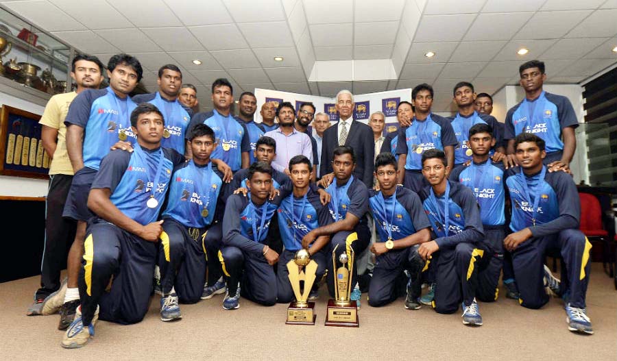 Members of Sri Lanka Under-19 team pose with the trophy after beating Pakistan Under-19 team in the fifth ODI at Colombo on Sunday.