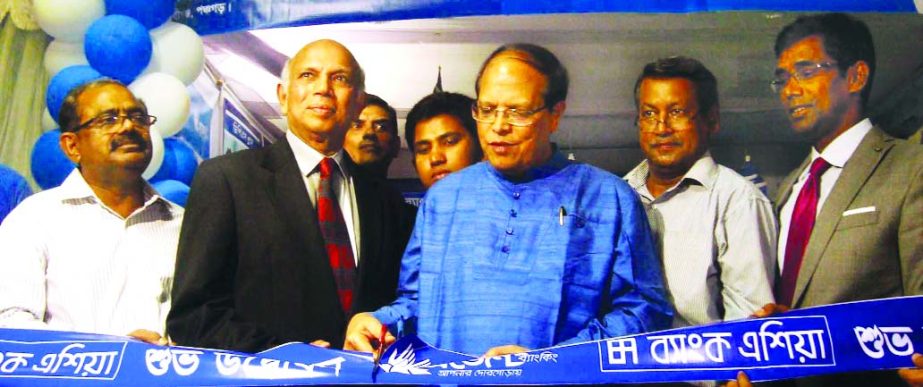 Bangladesh Bank Governor Dr Atiur Rahman, inaugurating an agent-banking outlet of Bank Asia on Sunday at Debiganj upazila (Exenclave) in Panchagarh district recently.