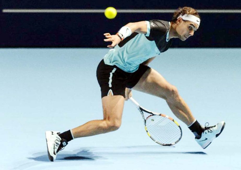 Spanish player Rafael Nadal tries to returns the ball to Czech player Lukas Rosol during the Swiss Indoors tennis tournament in Basel, northern Switzerland on Monday.