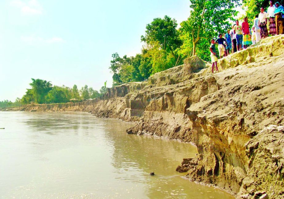 With flood waters started receding at Dudhkumar River, serious erosion hit Ghogadah under Sadar Upazila in Kurigram affecting hundreds of families around the riverbank. This photo was taken on Tuesday.