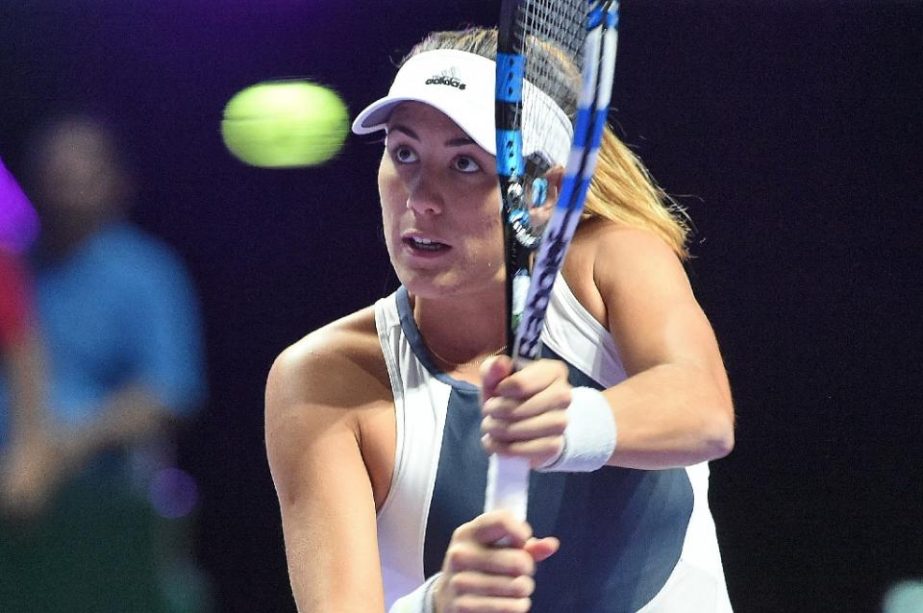 Spain's Garbine Muguruza sweeps to victory against the Czech Republic's Petra Kvitova in a round-robin match at the WTA Finals in Singapore on Friday.