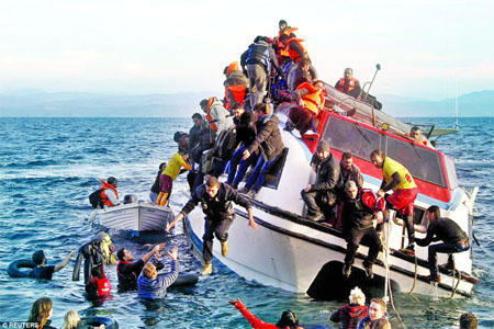 Refugees, most of them Syrians, struggle to leave a half-sunken catamaran carrying around 150 refugees as it arrives on the Greek island of Lesbos, after crossing part of the Aegean sea from Turkey on Friday. Internet photo