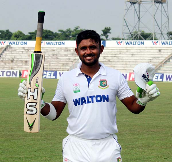 Shahriar Nafees of Barisal Division celebrates after scoring a century against Chittagong Division on the first day of the four-day National Cricket League between Barisal Division and Chittagong Division at the Shaheed Chandu Stadium in Bogra on Saturday