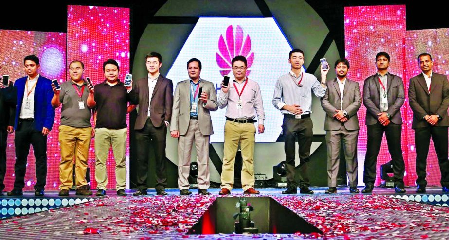 Picture shows Directors and distributors of Huawei Device Business pose with its latest version smart phone "G7 Plus"" at the launching ceremony at a city hotel on Sunday."
