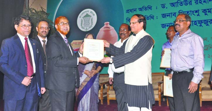 Bangladesh Governor Dr Atiur Rahman, handing over "School Banking Award" by Bangladesh Bank to Abdus Sadeque Bhuiyan, Deputy Managing Director of IBBL at Bangladesh Bank Training Academy recently.