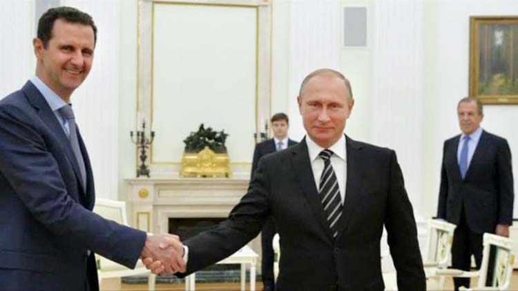 Syrian President Bashar al-Assad shaking hands with Russian President Vladimir Putin at the Kremlin in Moscow. AP file photo