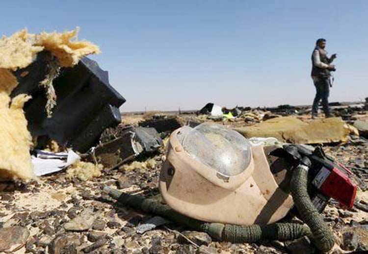 The debris from a Russian airliner is seen at its crash site at the Hassana area in Arish city, north Egypt.