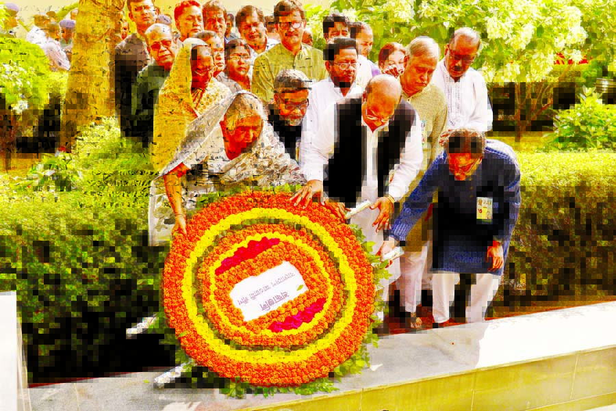 Awami League leaders and family members placing floral wreaths at the portrait of four national leaders at the Central Jail on Tuesday marking Jail Killing Day.