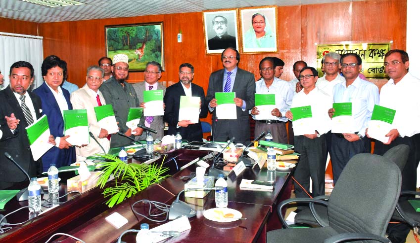 Chairman of National Board of Revenue (NBR) Md. Nojibur Rahman unveiling DCCI Tax Guide 2015-16 at the conference room of NBR in the city on Wednesday.