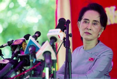 Myanmar's opposition leader Aung San Suu Kyi addresses the media at a press conference at her home in Yangon