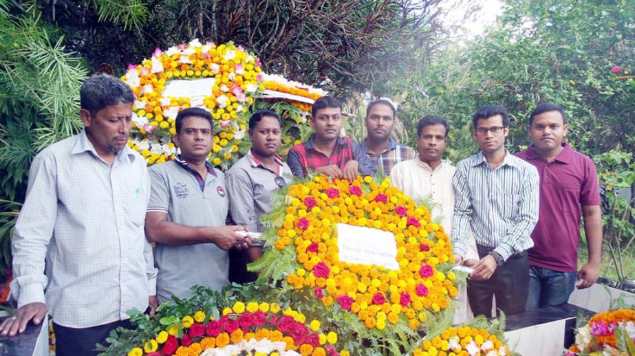 Members of Rouzan Press Club placing wreaths at the graveyard of Sajeda Begum, mother of A B M Fazley Karim Chowdhury, Chief Patron of the club recently.