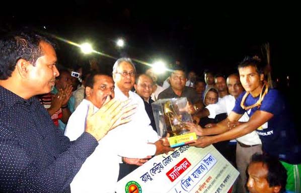 Water Resources Minister Barrister Anisul Islam Mahmud distributing prizes among the winners of boat race competition at Ramu in Cox'sBazar recently.