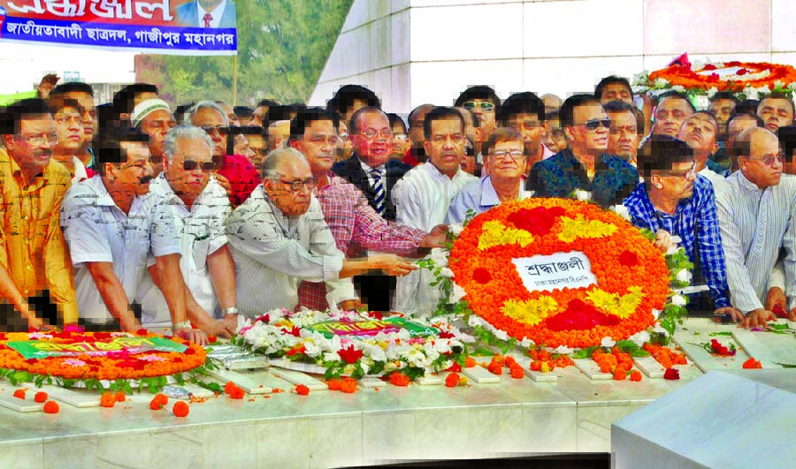 Leaders and activists of BNP placing floral wreaths at the Mazar of Shaheed President Ziaur Rahman in the city on Saturday marking National Revolution and Solidarity Day.