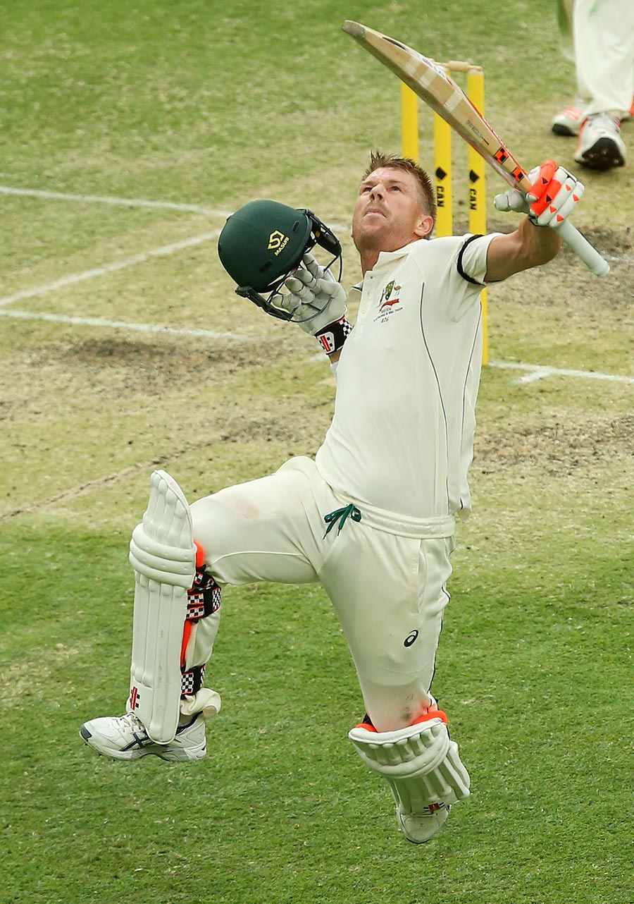 The trademark David Warner leaps on reaching a century on third day of 1st Test between Australia and New Zealand at Brisbane on Saturday.