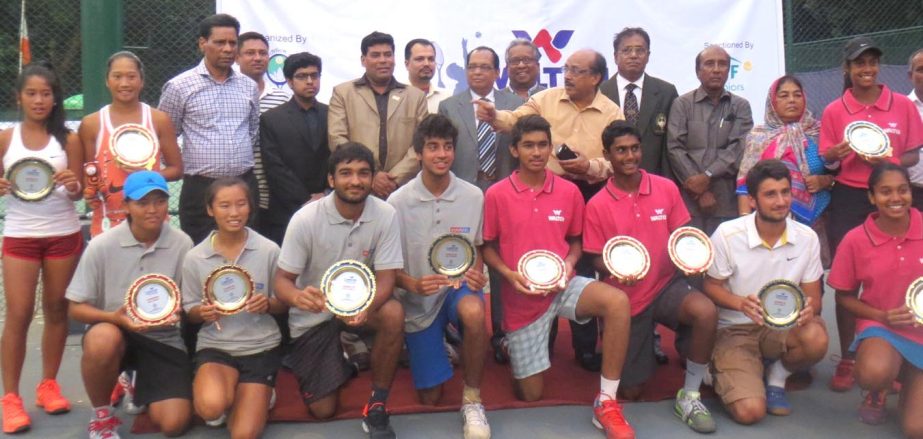 Prize winners of Walton 29th Bangladesh International Junior Tennis Championship pose for photo with their trophies and guests at the Ramna National Tennis Complex on Saturday.
