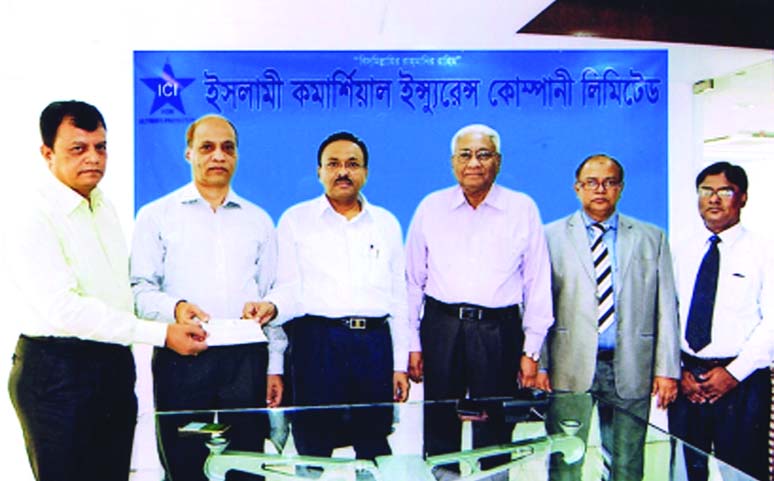 Md Anowar Hossain, Chairman of Board of Directors and Niaz Ahmed, Chairman of Claims Committee of Islami Commercial Insurance Company Ltd, handing over a Cheque of Tk 8,14,03,103= to Biman Bihari Roy, Director (Finance & Marketing) of Ms. Warm-Me Woolen