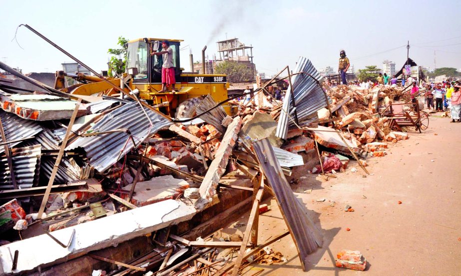 Bangladesh Railway authorities evicted illegal structures on its land at Jurain area in city on Sunday.