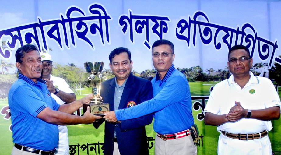 Commander of Logistic Area of Bangladesh Army Major General Mizanur Rahman Khan handing over the trophy to Logistics Area team, which emerged champions of the Bangladesh Army Inter-Formation Golf Competition at the Kurmitola Golf Club in Dhaka Cantonment