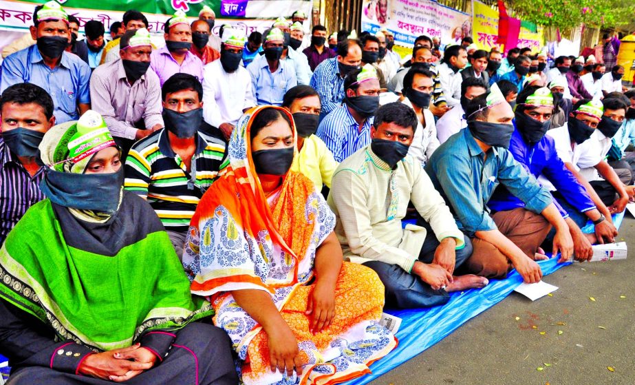 Non-MPO teachers continue silent agitation for 17th consecutive day on Wednesday for inclusion into MPO list shutting their mouths with black clothes