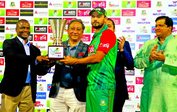 Captain of Bangladesh National Cricket team Mashrafe Bin Mortaza receiving the winners trophy from BCB President Nazmul Hassan Papon after whitewashing Zimbabwe 3-0 in the three-match ODI series at the Sher-e-Bangla National Cricket Stadium in Mirpur on W