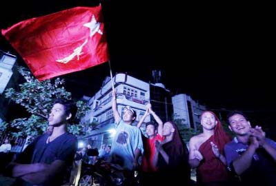 Supporters of opposition leader Aung San Suu Kyi watch polling results come in on a TV monitor at the National League for Democracy (NLD) offices after the general election in Mandalay, Myanmar.