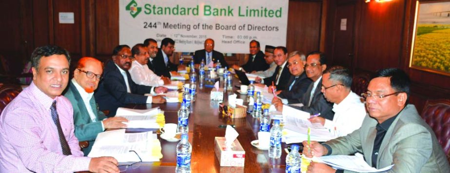 Kazi Akram Uddin Ahmed, Chairman of the Board of Directors of Standard Bank presiding over the 244th board meeting at its head office recently. Managing Director of the bank Md. Nazmus Salehin and Deputy Managing Director Mamun- Ur- Rashid were present at