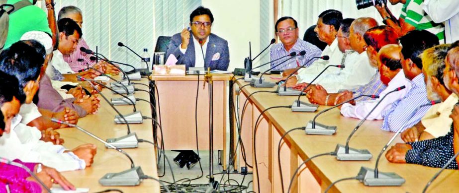 Mayor of Dhaka South City Corporation Mohammad Sayeed Khokon speaking at an opinion sharing meeting with the leaders of Bangladesh Hawkers' Federation at the seminar room of Nagar Bhaban on Thursday.
