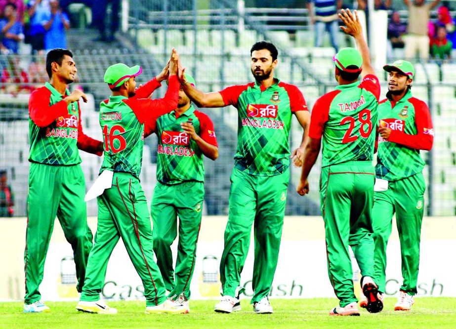 Skipper Mashrafe Mortaza celebrates with teammates after taking a wicket of Zimbabwe at the Sher-e-Bangla National Cricket Stadium in Mirpur on Friday.