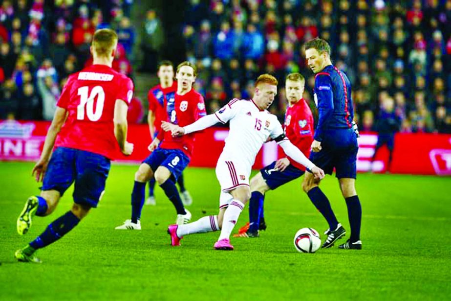 Hungary's Laszlo Kleinheisler (centre) controls the ball as he lines up to score against Norway during their Euro 2016 play off match in Oslo on Thursday.