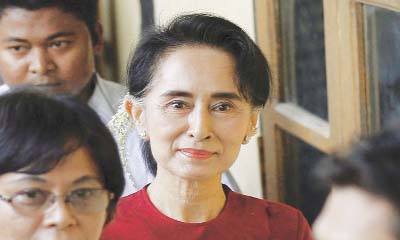 Pro-democracy leader Aung San Suu Kyi seen with the supporters after announcment of the polls result.