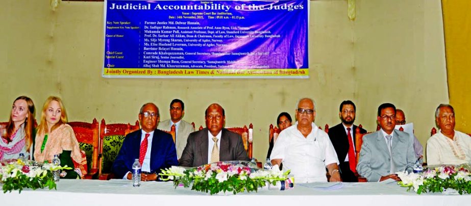 Justice Delwar Hossain along with other distinguished persons at a seminar on 'Judicial Accountability of the Judges' jointly organized by Bangladesh Law Times and National Bar Association of Bangladesh at the Supreme Court Bar Auditorium on Saturday.