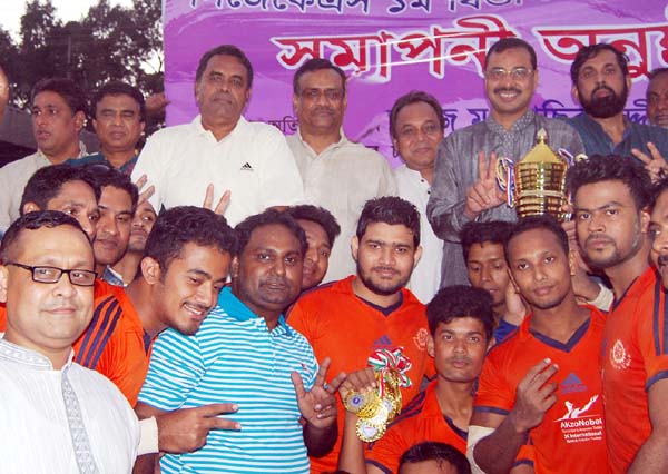 Members of Brothers Union, the champions of the Chittagong First Division Rugby League with the officials of CJKS pose for camera at the MA Aziz Stadium in Chittagong on Friday.