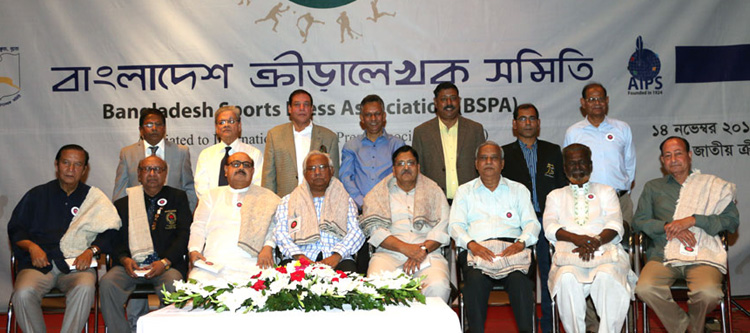 The recipients sports organizers and the officials of Bangladesh Sports Press Association pose for a photo session at the Auditorium of National Sports Council Tower on Saturday.