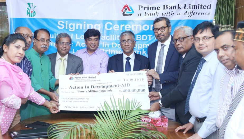 Ahmed Kamal Khan Chowdhury, Managing Director of Prime Bank Limited and Tarikul Islam Palash, Chief Executive of Action In Development- AID sign an agreement of Tk 40m agriculture loan at the bank's head office on Sunday.