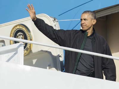 US President Barack Obama disembarks Air Force One after arriving at Antalya International Airport in Antalya, Turkey, for the G20 summit on Sunday.