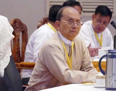 Myanmar President Thein Sein attends a meeting with representatives of political parties at Yangon region government office in Yangon, Myanmar on Sunday.