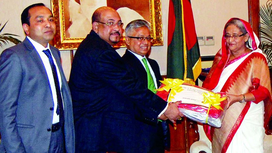 Nizam Chowdhury, Chairman, Mohammad Hanif Chowdhury, Vice-Chairman and Proshanta Kumar Halder, Managing Director of NRB Global Bank Limited, handing over 50 thousand pcs of blankets to Prime Minister Sheikh Hasina for her relief fund at Gonobhaban recentl