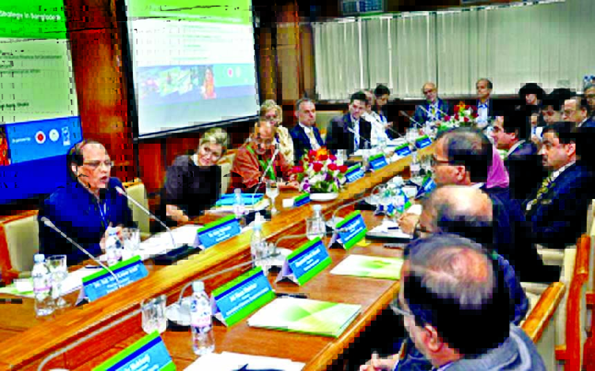 Bangladesh Bank (BB) Governor Dr. Atiur Rahman speaking at a seminar on "National Financial Inclusion Strategy"" at its conference room in the city on Tuesday. Addressing as chief guest Queen of the Netherlands MÃ¡xima Zorreguieta Cerruti is seen besid"