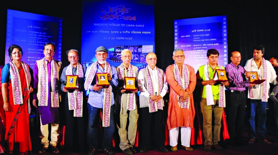 University Grants Commission Chairman Prof Abdul Mannan along with the recipients of citation at a programme organized for distribution citations among the musicians and music directors by Music Department of Dhaka University at TSC of the university on W