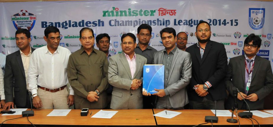 Senior Vice-President of Bangladesh Football Federation (BFF) Abdus Salam Murshedy and Md MA Razzak Khan,Chairman of the Minister High-tech Limited shaking hands after signing agreement between BFF and Minister High-tech Limited at the conference room of