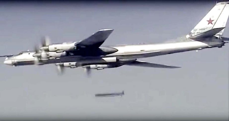 A Russian Tu-95 bomber launches a cruise missile at a target in Syria onThursday Russia's defence minister said its warplanes have fired cruise missiles on militant positions in Syria's Idlib and Aleppo provinces .